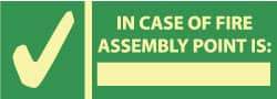 NMC - In Case of Fire - Assembly Point Is: _______, Pressure Sensitive Vinyl Exit Sign - 14" Wide x 5" High, Glow-in-the-Dark - Americas Tooling