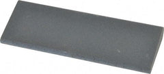 Norton - 4-1/2" Long x 1-3/4" Diam x 1/2" Thick, Silicon Carbide Sharpening Stone - Round, Fine Grade - Americas Tooling